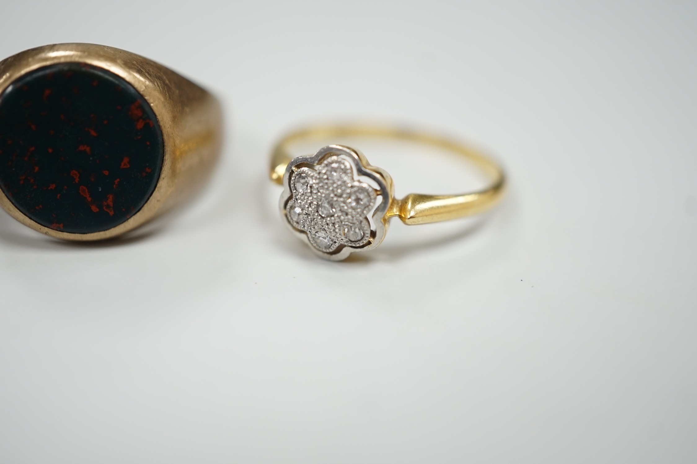 A 1920's 18ct and diamond chip set cluster ring, size N, gross 2.4 grams and two 9ct rings including bloodstone set signet, gross 7.2 grams.